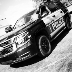 We did a partial white and black wrap on the doors of this black Ford for Greenfield Police Department.